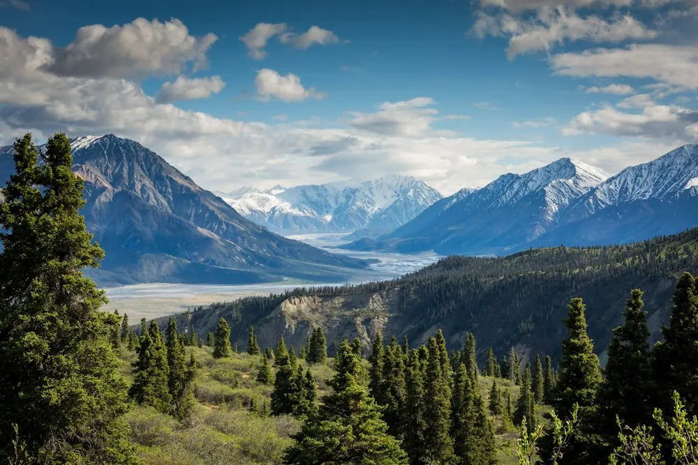 A mountain range above an expansive valley